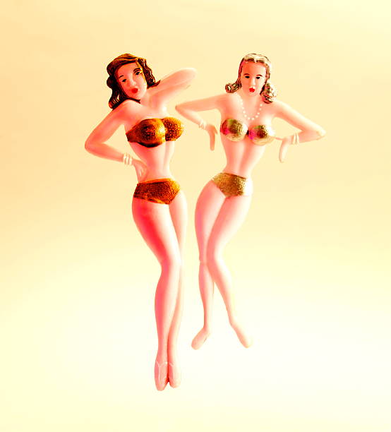 istock Two Woman Putting on Bikinis 465417292