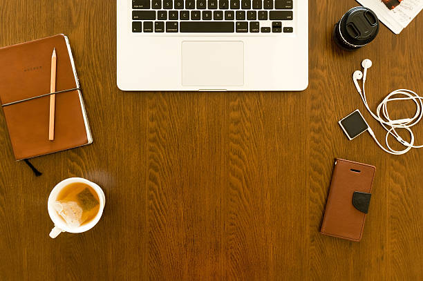 istock Modern workspace with laptop, smartphone, mug, and gadgets 465417400