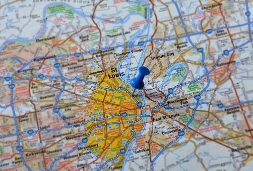 Push pin indicating position of St. Louis, Missouri on a generic map. Surrounding area slightly blurred leaving St. Louis in focus.
