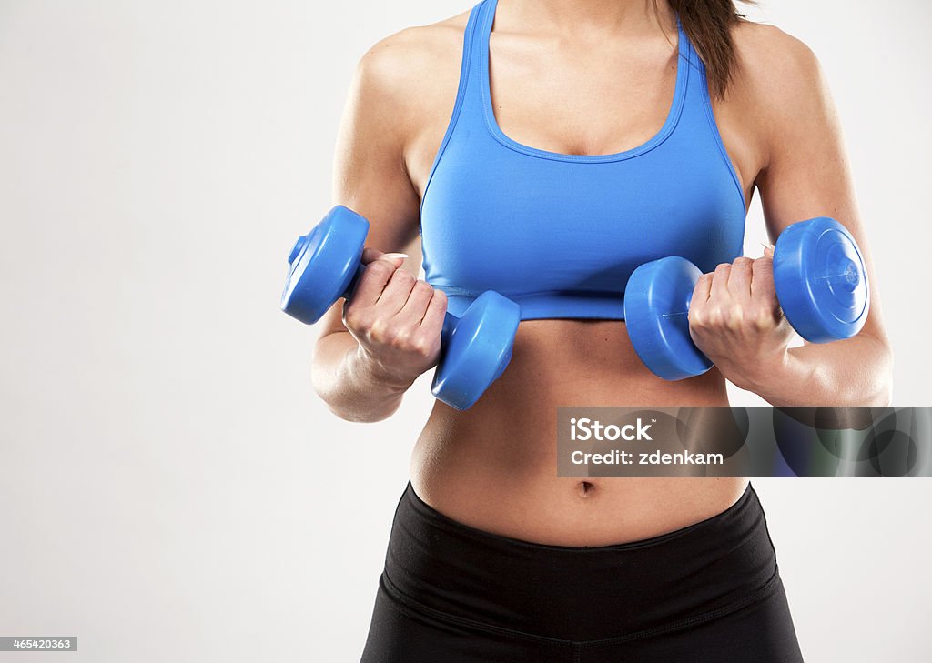 fitness woman fitness model brunette wearing blue outfit on light background 20-29 Years Stock Photo