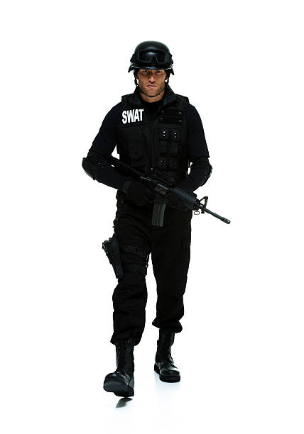 istock Front view of police walking with rifle 465420845