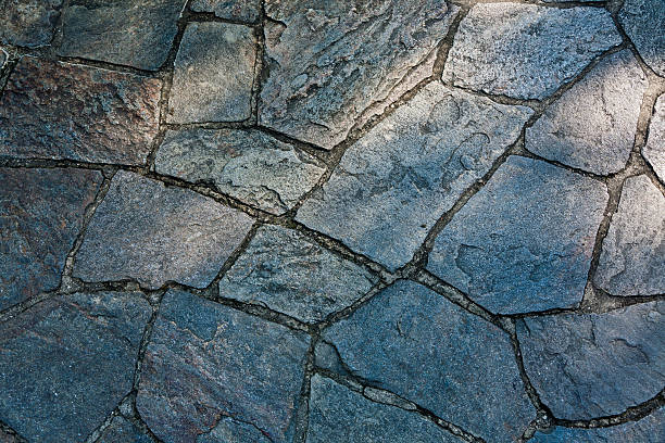Dry Laid Rough Textured Flagstone Walkway in the Sunlight