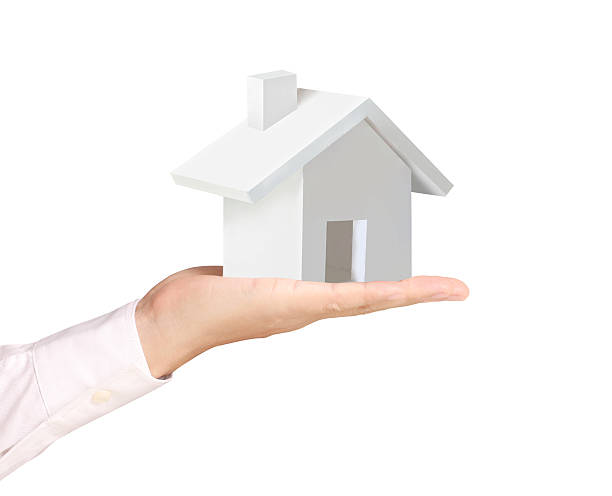 istock holding house representing home ownership 465421625