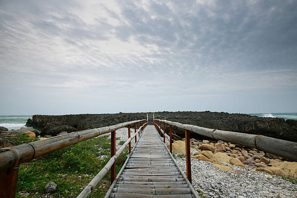 istock Bamboo bridge leading to coral reefs 465422168