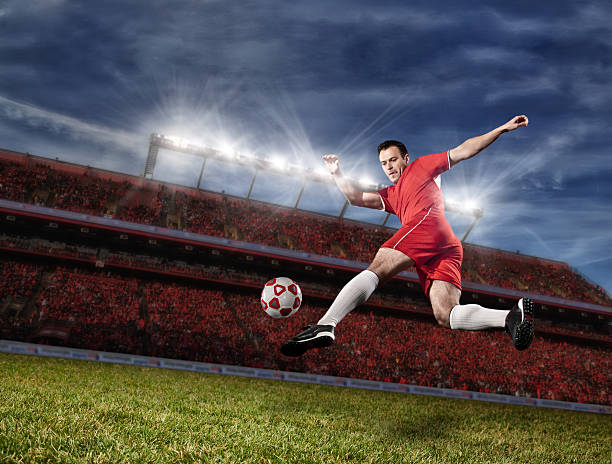 istock Soccer Player Kicking the Ball while Jumping in mid-air 465424707