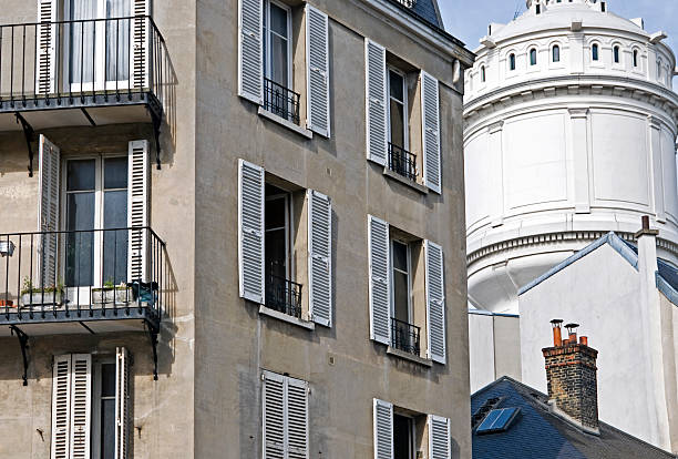 istock Apartment and water tower in Paris 465425409
