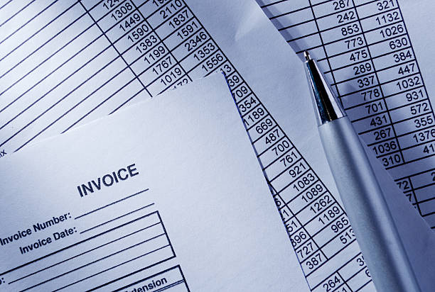 istock A layout of invoice, spreadsheet and a pen  465425572