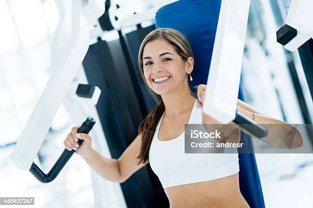 Woman Exercising At The Gym Stock Photo - Download Image Now - Adult, Adults Only, Anaerobic Exercise