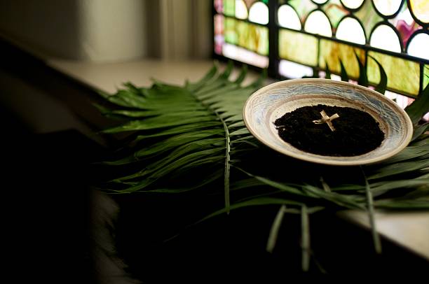 Holy Lent We prepare for the Lenten Season with the imposition of Ashes. The palm branches from last year during Holy Week are burned to prepare for this year’s Ash Wednesday. liturgy photos stock pictures, royalty-free photos & images