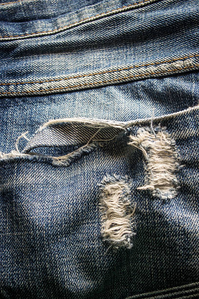 istock Texture of blue jeans background 465428396