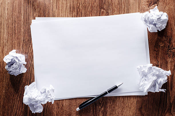 istock Blank Papers and Pen with Crumpled Papers on Sides 465428492