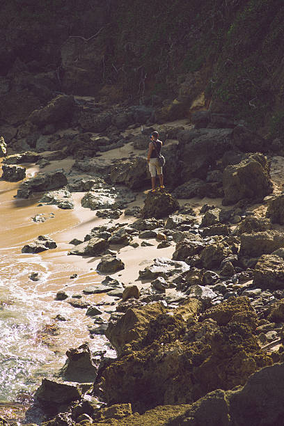 istock Man taking photo of the beach 465429215