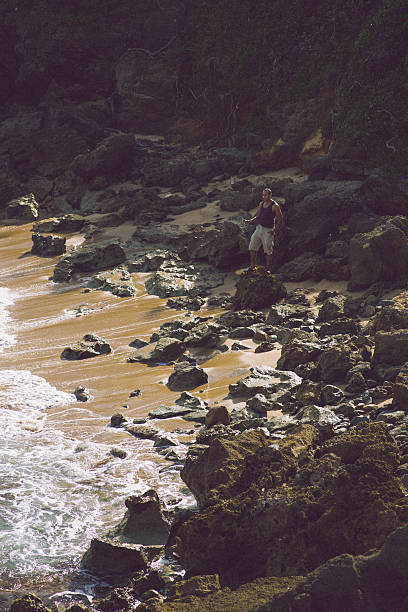 istock Man taking photo of the beach 465429237