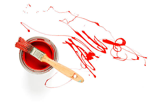 istock Paintbrush with red paint on a can 465431983