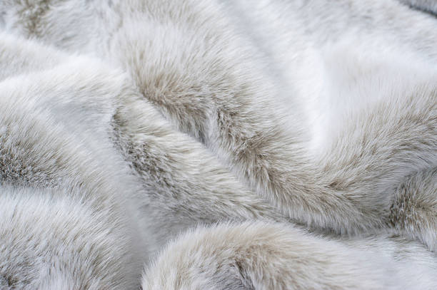 Fake fur blanket A cozy blanket made from fake bear skin fluffy blanket stock pictures, royalty-free photos & images