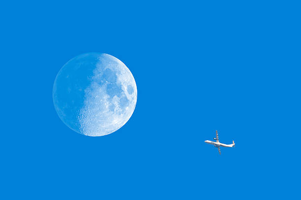 Half Moon and Airplane Almost full Moon and old airplane - sharp details.   contrail moon on a night sky stock pictures, royalty-free photos & images