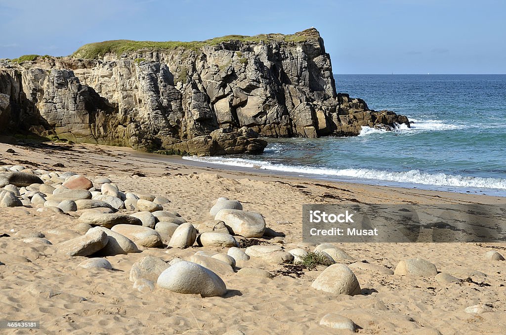 Beach and cliff at Quiberon peninsula in France Beach and cliff on the rocky wild coast of the peninsula of Quiberon in the Morbihan department in Brittany in north-western France Atlantic Ocean Stock Photo