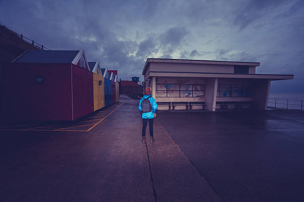 istock Hiker standing on the promenade near water 465436111