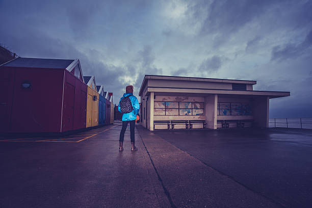 Hiker standing on the promenade near water