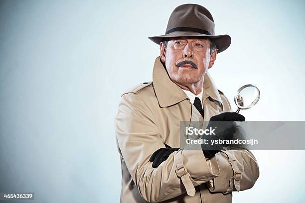 Retro Detective Man With Mustache And Hat Holding Magnifying Glass Stock Photo - Download Image Now
