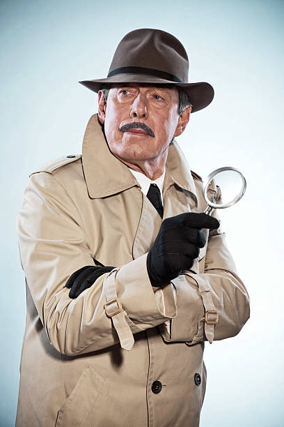 istock Retro detective man with mustache and hat. Holding magnifying glass. 465436345
