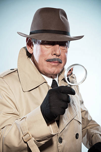 istock Retro detective man with mustache and hat. Holding magnifying glass. 465436359