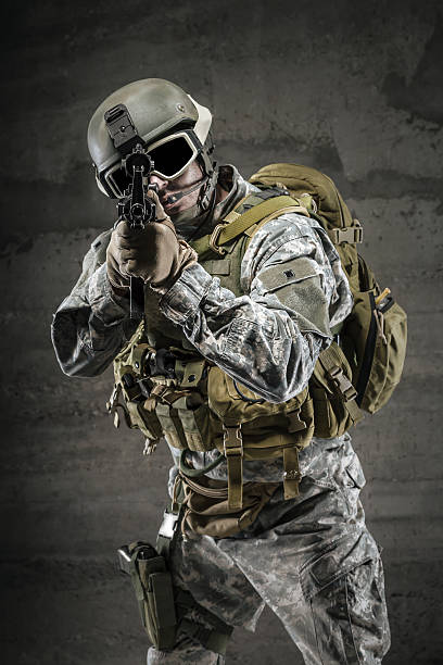 istock Soldier pointing gun at you 465436599