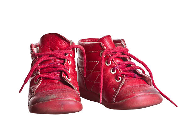 istock old red used baby shoes 465441299