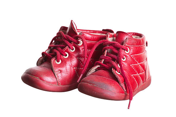 istock old red used baby shoes 465441305