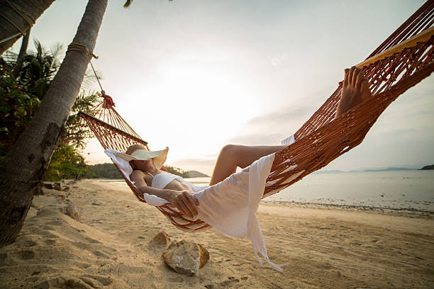 istock Woman sleeping on hammock-Tropical vacation 465441704