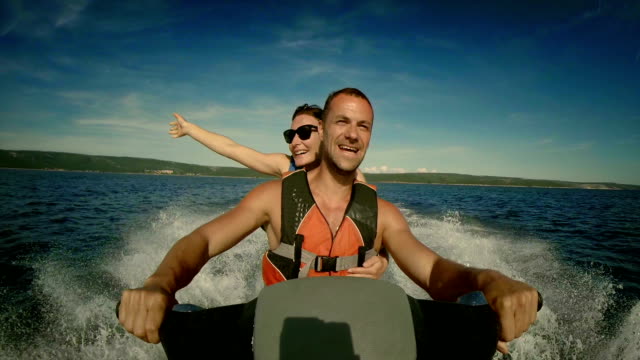 POV Cheerful Couple On A Jet Boat