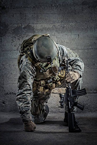 istock Soldier with rifle and helmet 465443709
