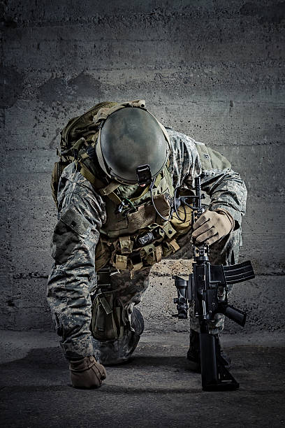 Soldier with rifle and helmet Soldier with rifle and helmet shooting guard stock pictures, royalty-free photos & images