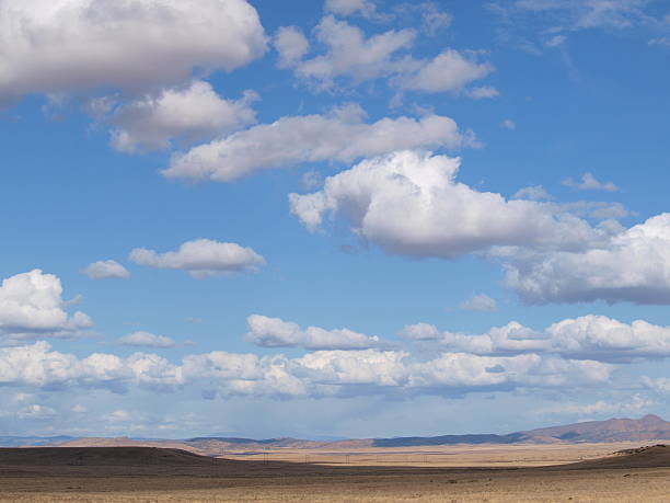 istock Blue Sky with white clouds drifting over western landscape 465444378