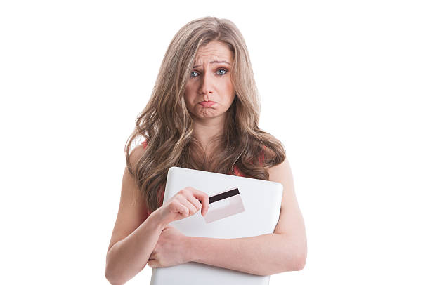 istock Sad female holding empty credit card 465444414