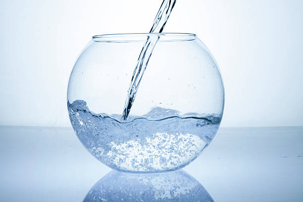 Water being poured in an empty bowl