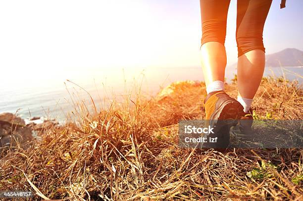 A Hikers Feet On High Ground Above The Coastline Stock Photo - Download Image Now - Hiking, Beach, Walking