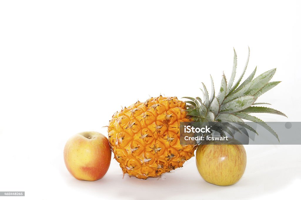 Display Of Two Shiny Apples And A Pineapply display of two shiny apples and a pineapply Apple - Fruit Stock Photo