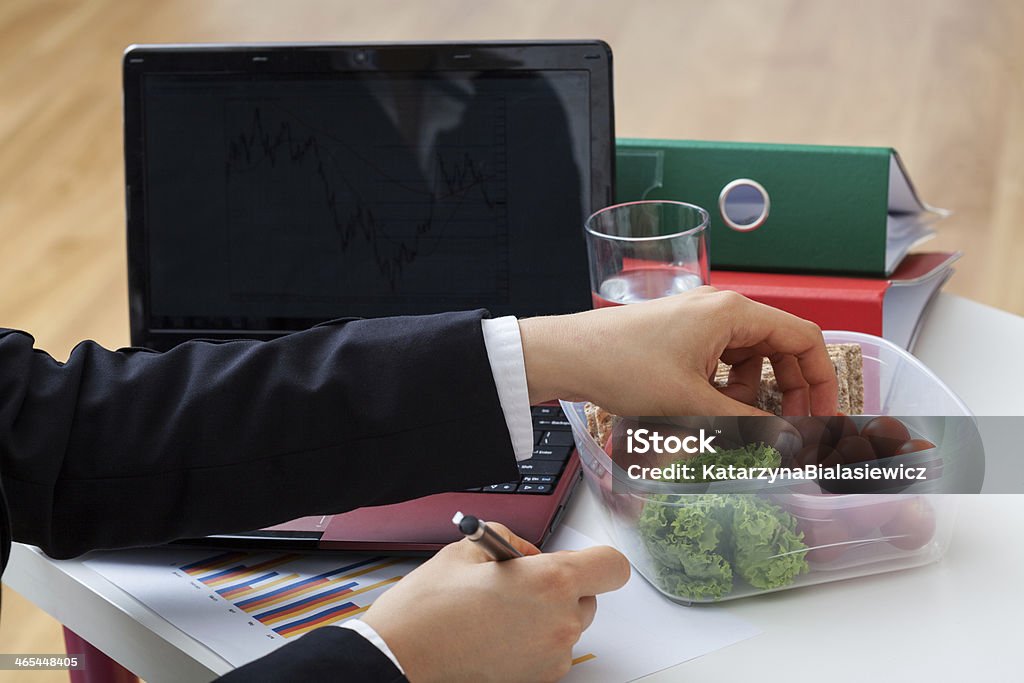 Light fresh meal at office Woman eating light vegetable meal at office Adult Stock Photo