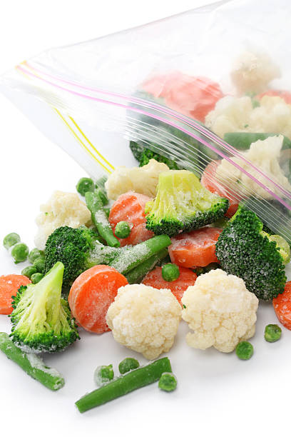 istock Assorted homemade vegetables being taken out from ziploc bag 465448667