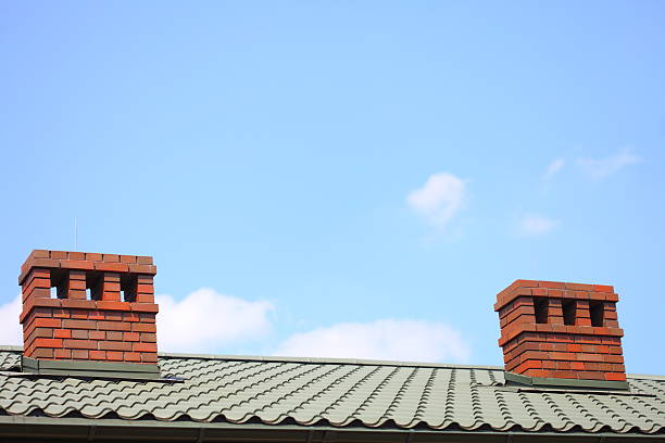 istock Chimney on the roof sky background 465449273