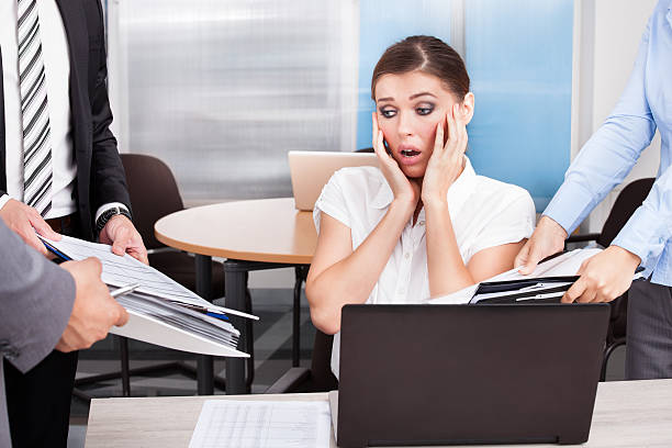 istock Shocked Businesswoman Looking At Folders 465449979
