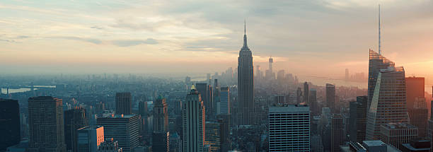istock Empire State and Lower Manhattan skyline at dusk 465452461