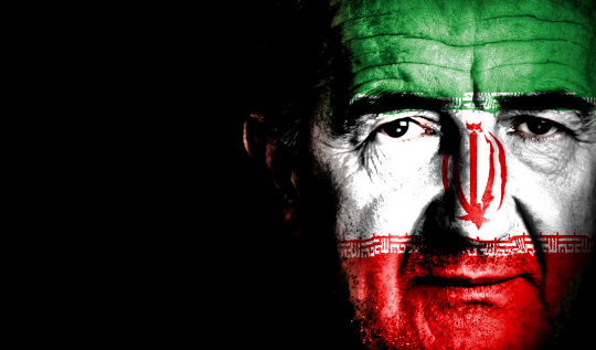 Iranian man with national flag painted over his face. Soccer or Sport Supporter.