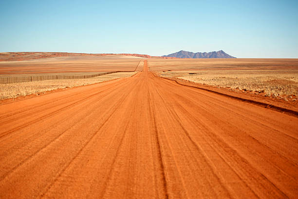 istock Empty Red Gravel Road in Namibia 465453058