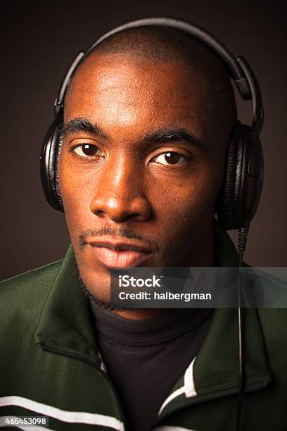 Portrait Of Man Wearing Headphones Stock Photo - Download Image Now - 20-29 Years, 2015, 25-29 Years