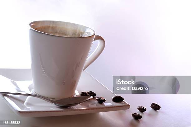 Steaming Cup Of Coffee And Beans Stock Photo - Download Image Now - 2015, Biology, Black Color