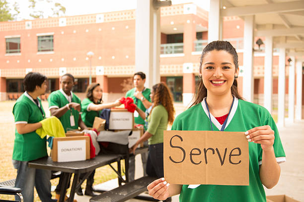 istock Volunteers: College students collect clothing donations for community. 465457213