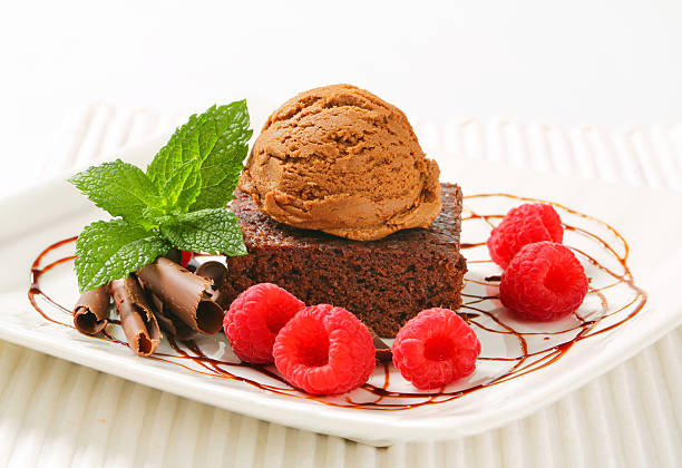 istock Chocolate Brownie with ice cream and raspberries 465457775