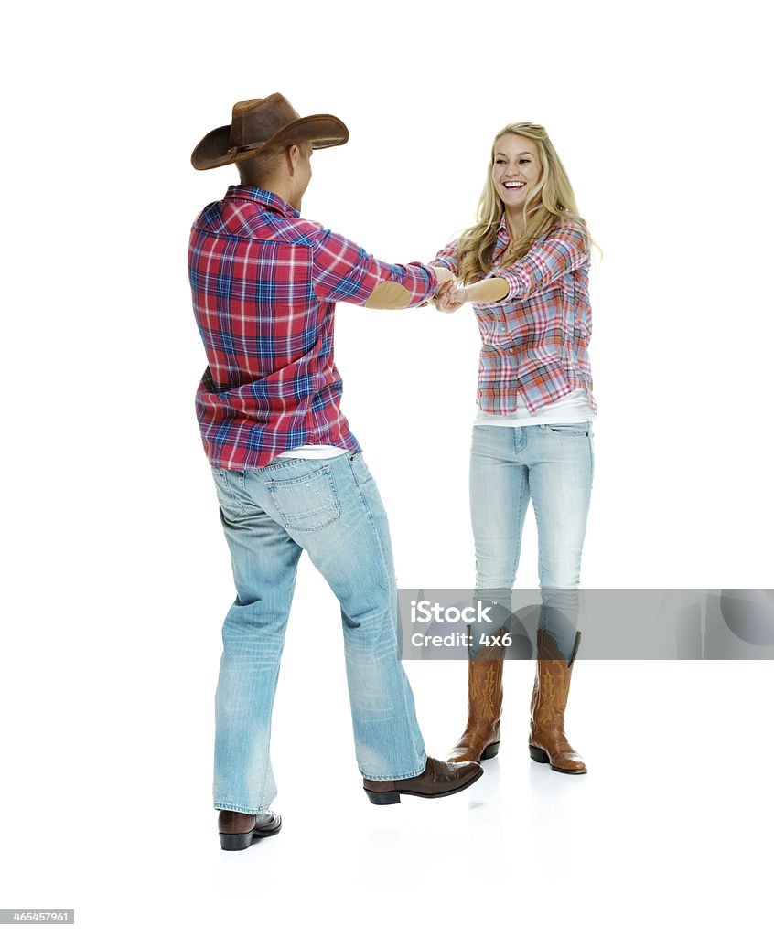 Cheerful young couple dancing Cheerful young couple dancinghttp://www.twodozendesign.info/i/1.png 20-29 Years Stock Photo